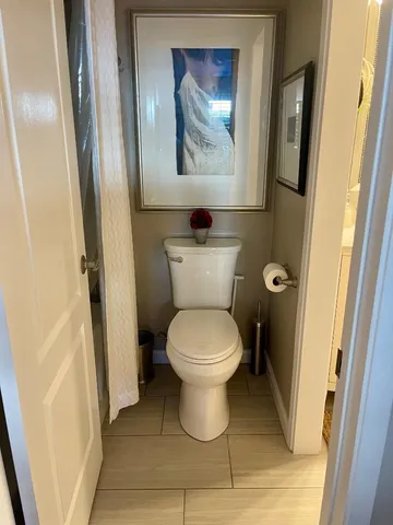 a bathroom with a toilet and a sink