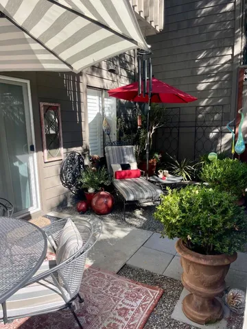 a view of a chairs and tables in patio