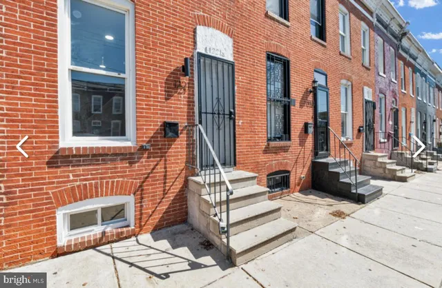 a view of a brick building with many windows