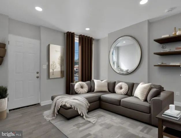 a living room with furniture and a large mirror