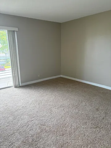 a view of a air conditioner and an empty shelf