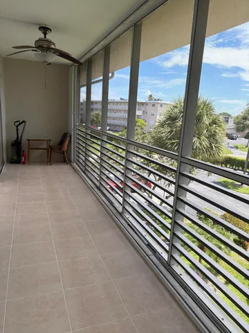 a view of a swimming pool with a yard