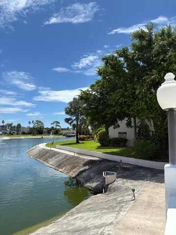 a view of a lake with a building in the background