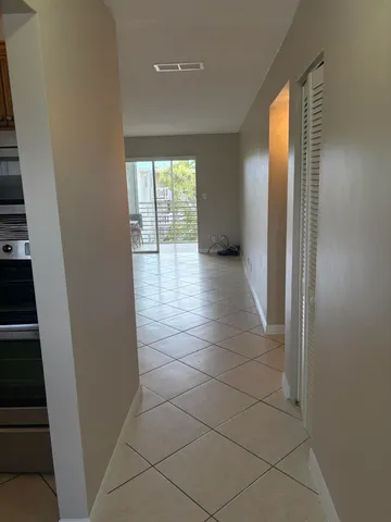 a kitchen with granite countertop a sink and cabinets