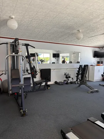 a view of a swimming pool and an outdoor seating