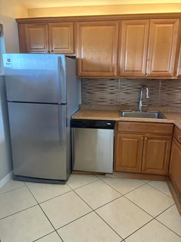 a view of an entryway with a kitchen