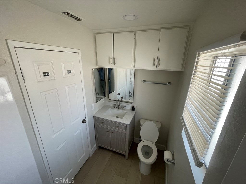3703 Country Oaks Loop, Unit B Ontario, CA 91761 - Photo 22 of 30 a bathroom with a sink toilet and shower
