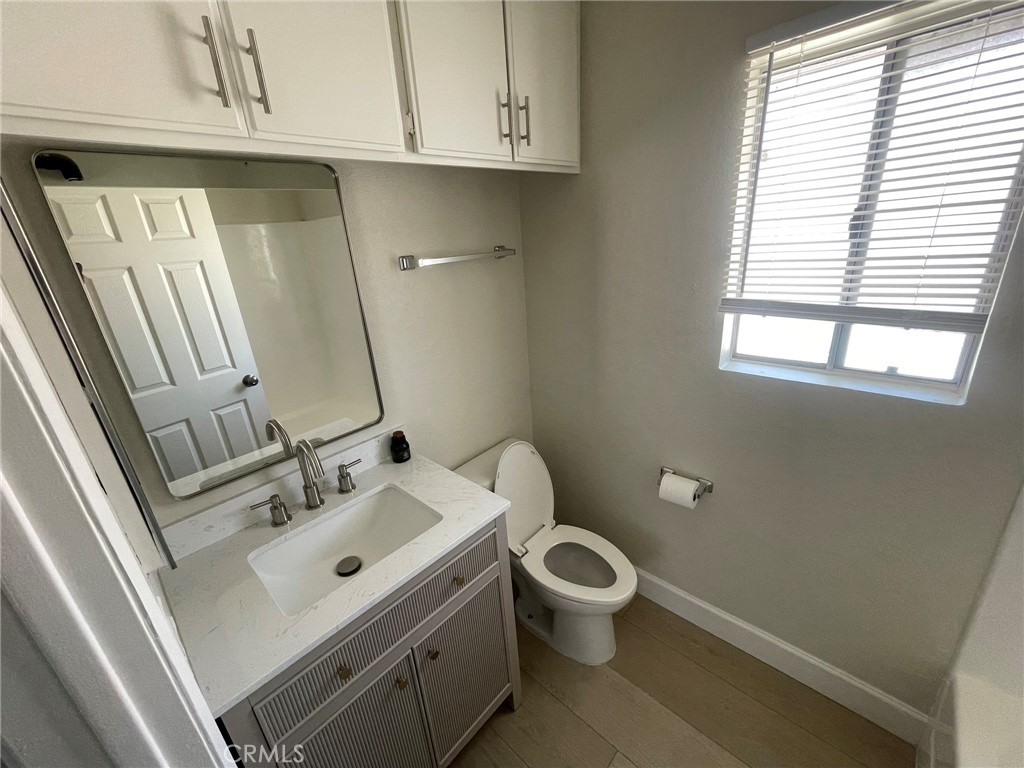 3703 Country Oaks Loop, Unit B Ontario, CA 91761 - Photo 23 of 30 a bathroom with a sink and a toilet