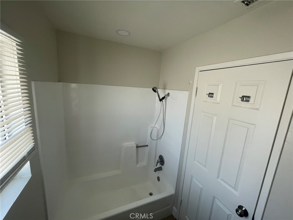 3703 Country Oaks Loop, Unit B Ontario, CA 91761 - Photo 24 of 30 a bathroom with a shower