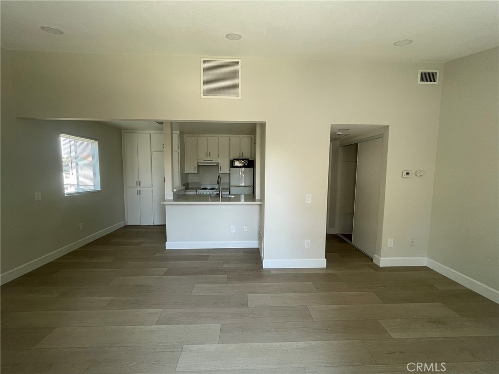 3703 Country Oaks Loop, Unit B Ontario, CA 91761 - Photo 5 of 30 a view of a kitchen with a sink cabinets and a window