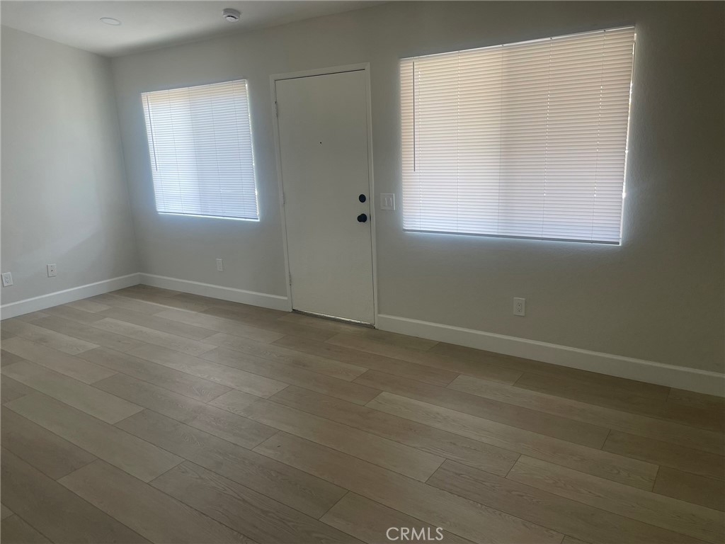 3703 Country Oaks Loop, Unit B Ontario, CA 91761 - Photo 8 of 30 an empty room with a window