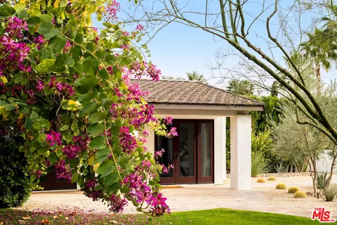 a front view of a house with yard
