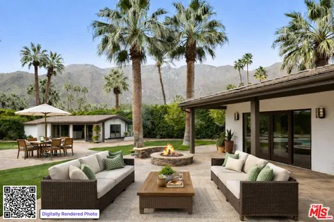 a view of a patio with couches potted plants and a table