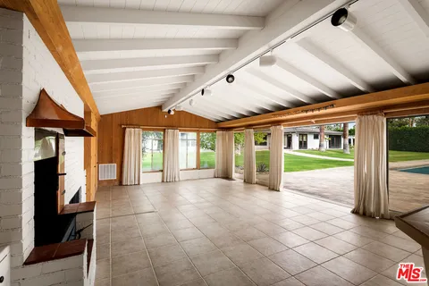 a living room with furniture ceiling fan and a rug