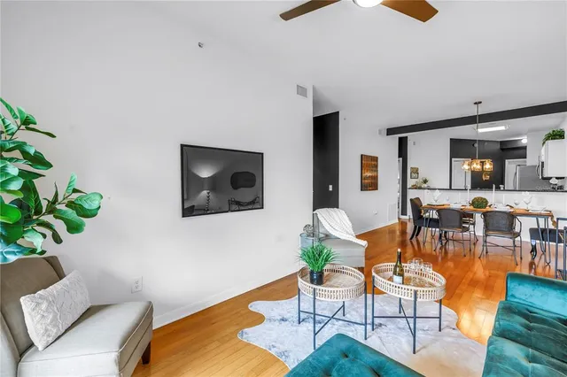 a living room with furniture and a lamp