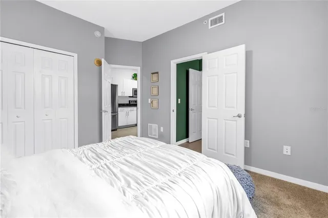 a bathroom with a toilet sink and a mirror