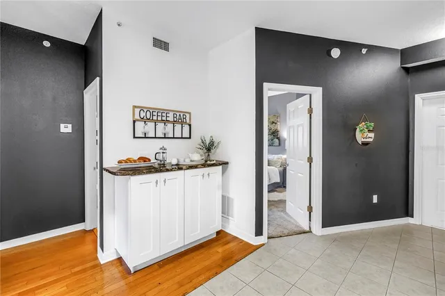 a kitchen with a sink stainless steel appliances and cabinets