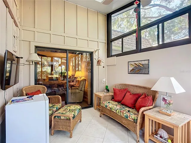 a living room with furniture a window and a fireplace