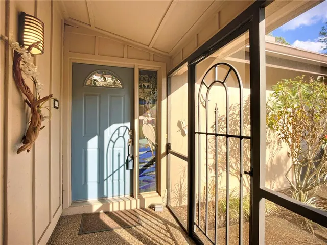 a view of a entryway door front of a house