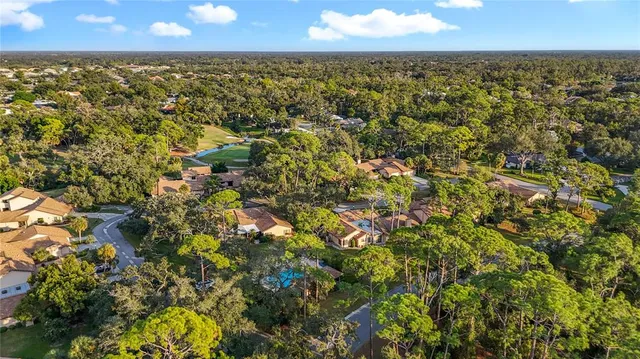 a view of a swimming pool with an outdoor space and seating area