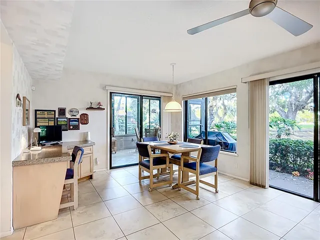 a view of a dining room with furniture and a window