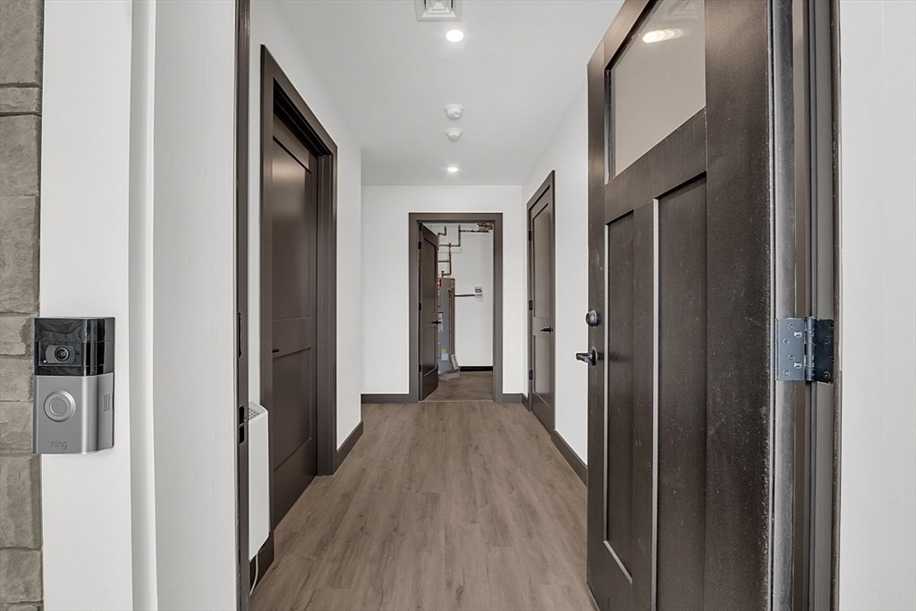 36 Vantage Point Drive, Unit 4 Laconia, NH 03246 - Photo 9 of 42 a view of a hallway with wooden floor