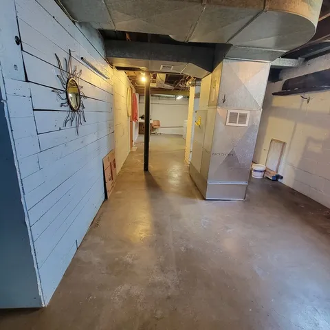 a outdoor space with pool table and chairs