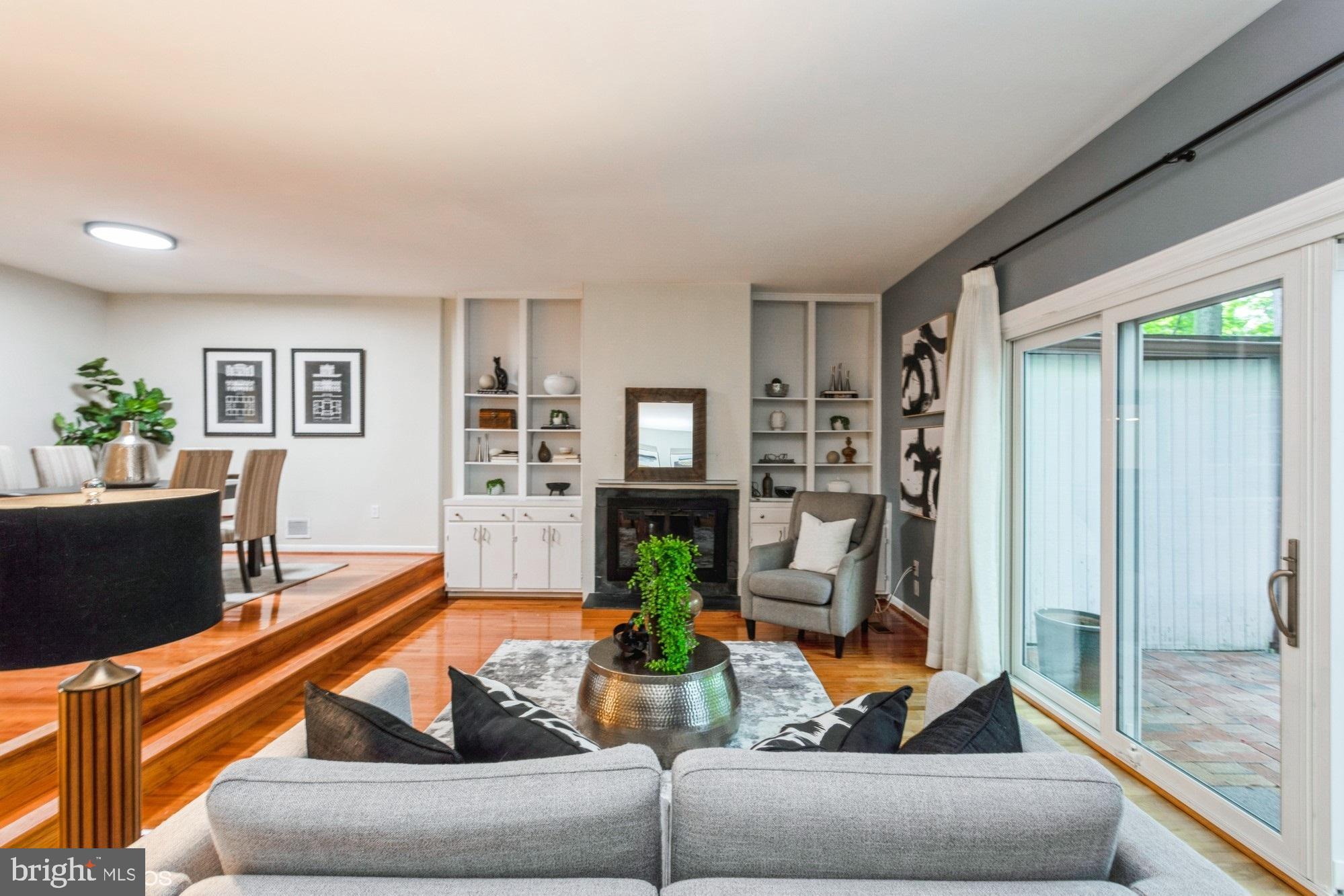 12015 Insha Court Reston, VA 20191 - Photo 13 of 39 STEP DOWN LIVING ROOM WITH FIREPLACE