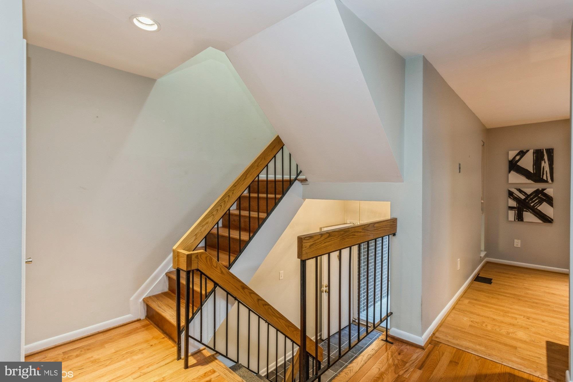 12015 Insha Court Reston, VA 20191 - Photo 19 of 39 WOOD STAIRCASE TO SECOND LEVEL