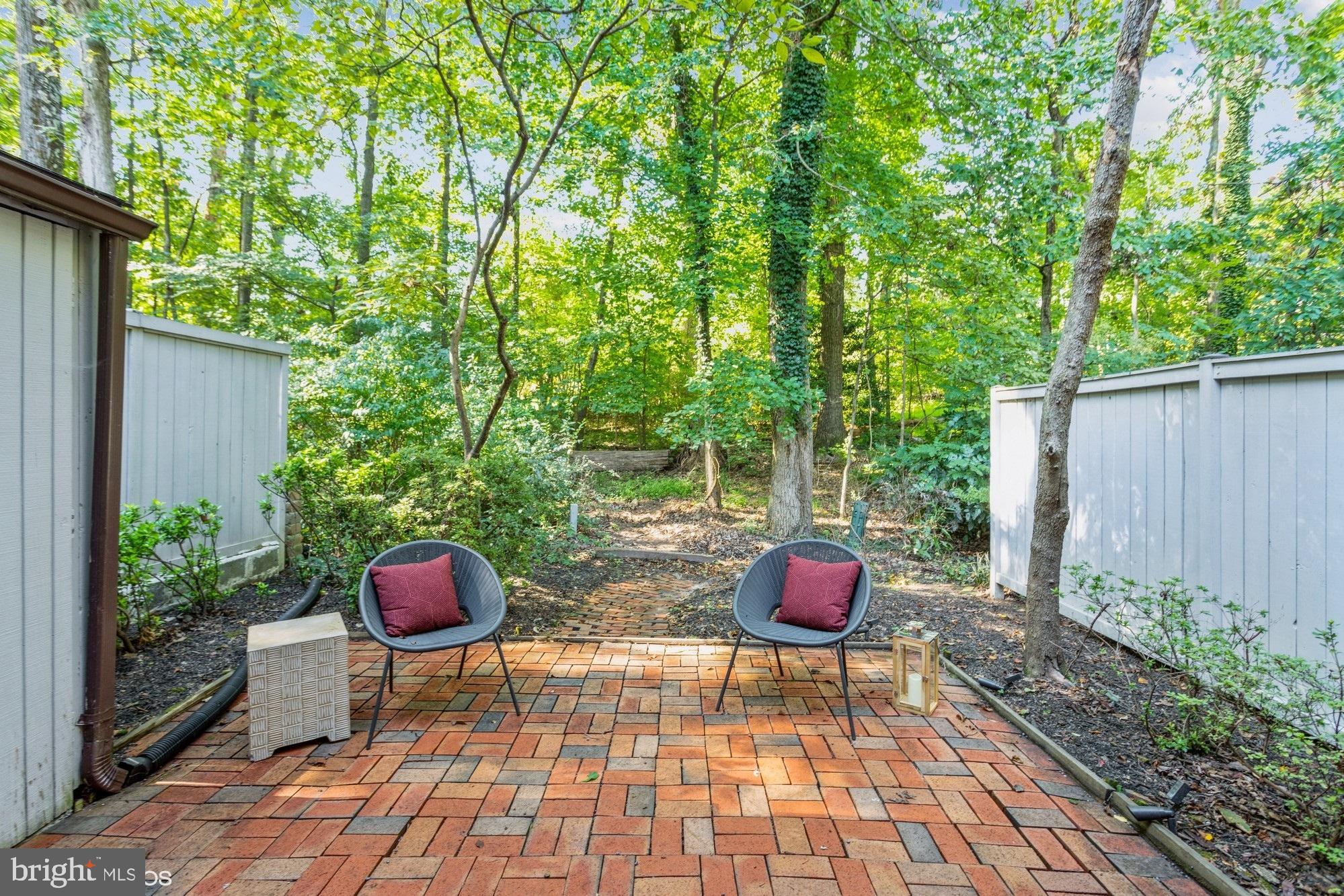 12015 Insha Court Reston, VA 20191 - Photo 34 of 39 BRICK PATIO OVERLOOKING TREES