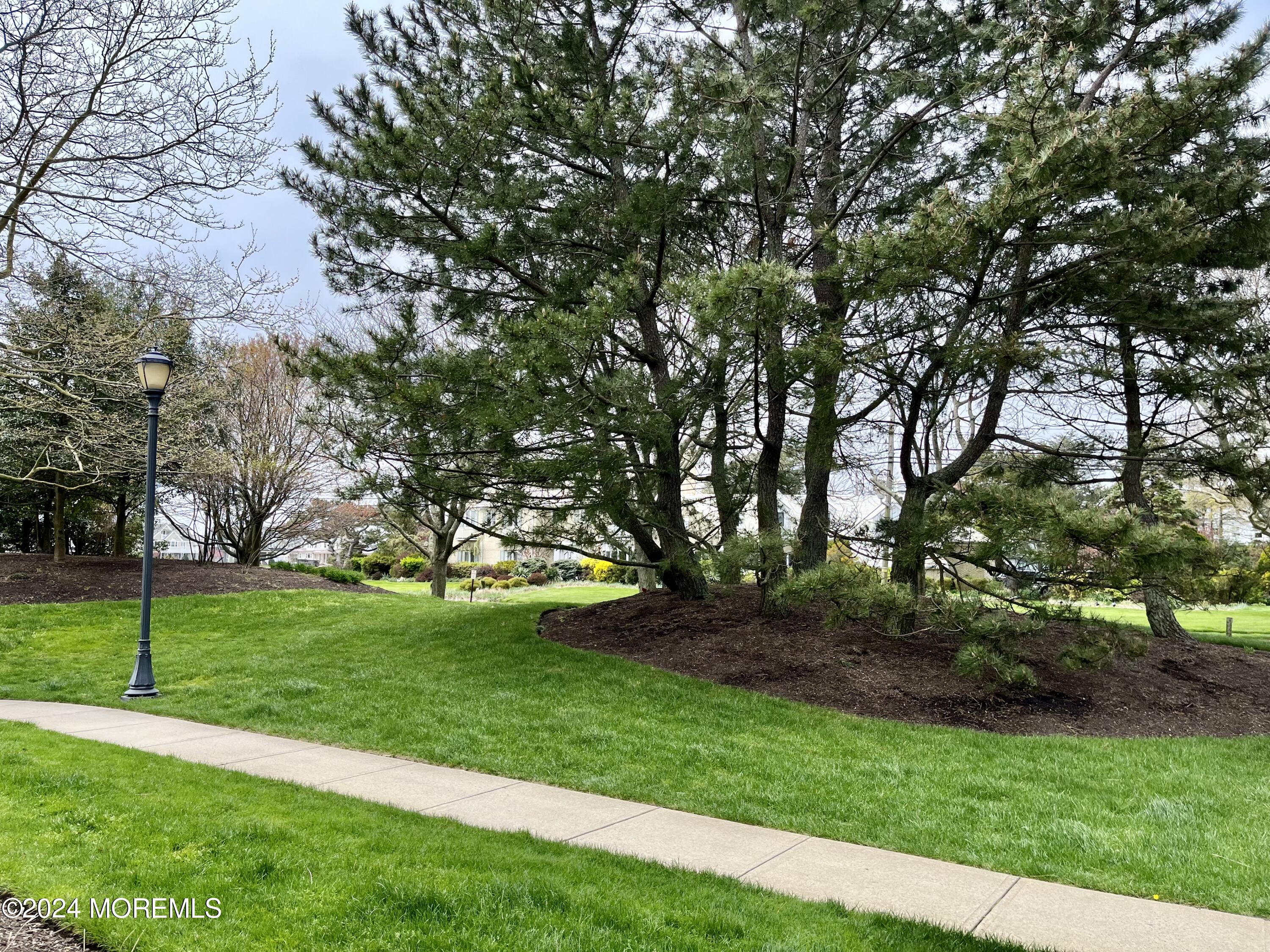 700 Ocean Avenue, Unit G38 Spring Lake, NJ 07762 - Photo 24 of 37 a view of a park with large trees
