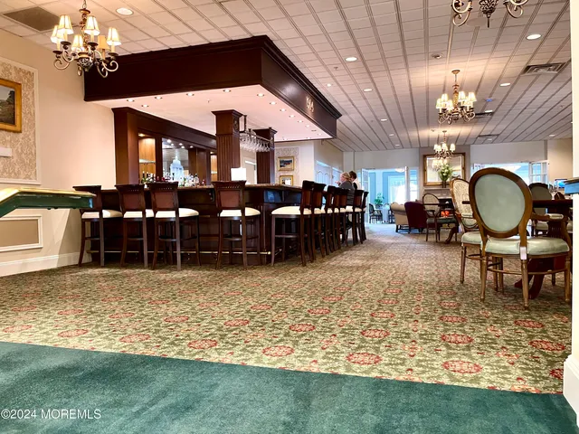 a dining table with chairs and window
