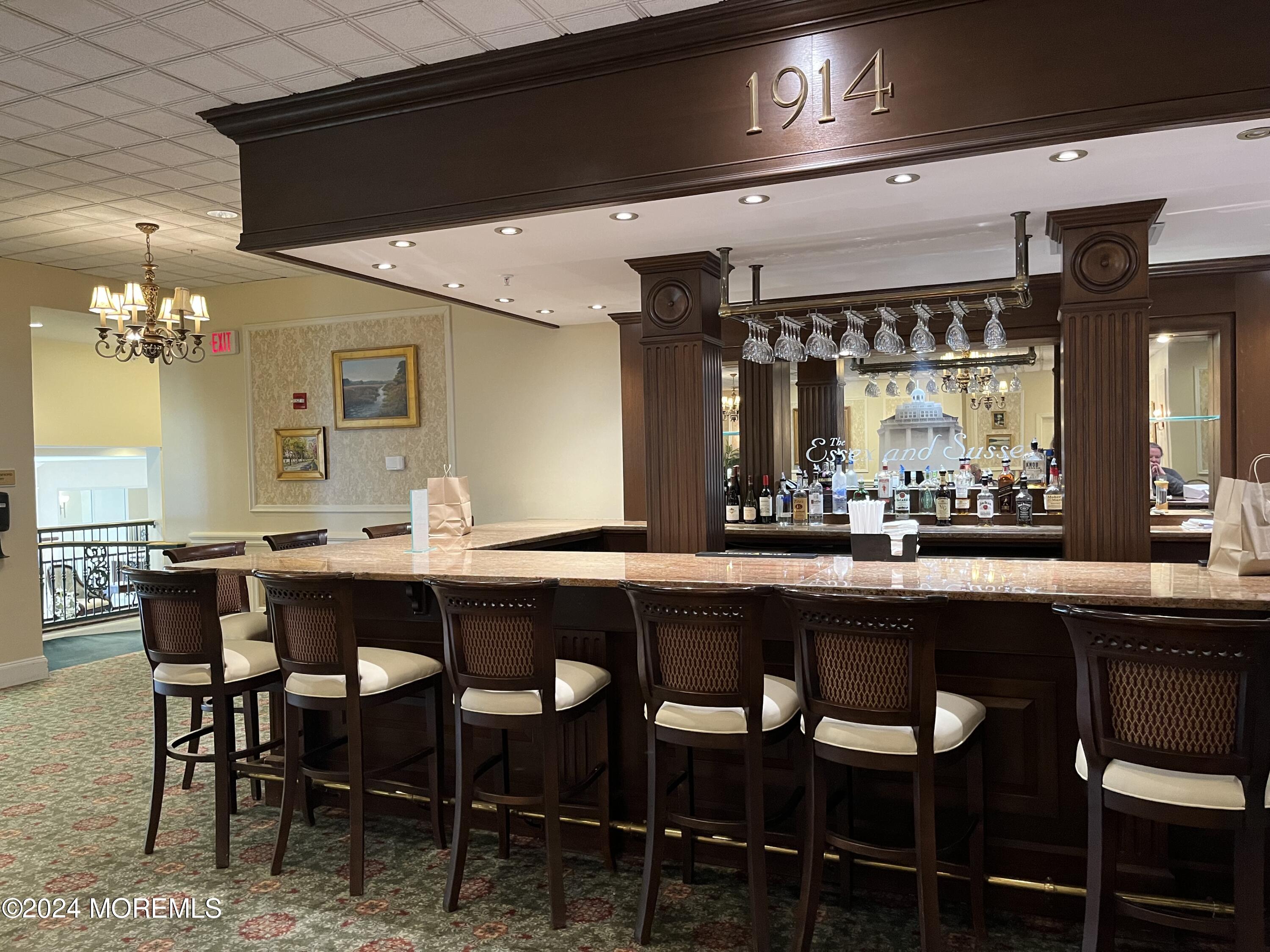 700 Ocean Avenue, Unit G38 Spring Lake, NJ 07762 - Photo 35 of 37 a dining table with chairs and window