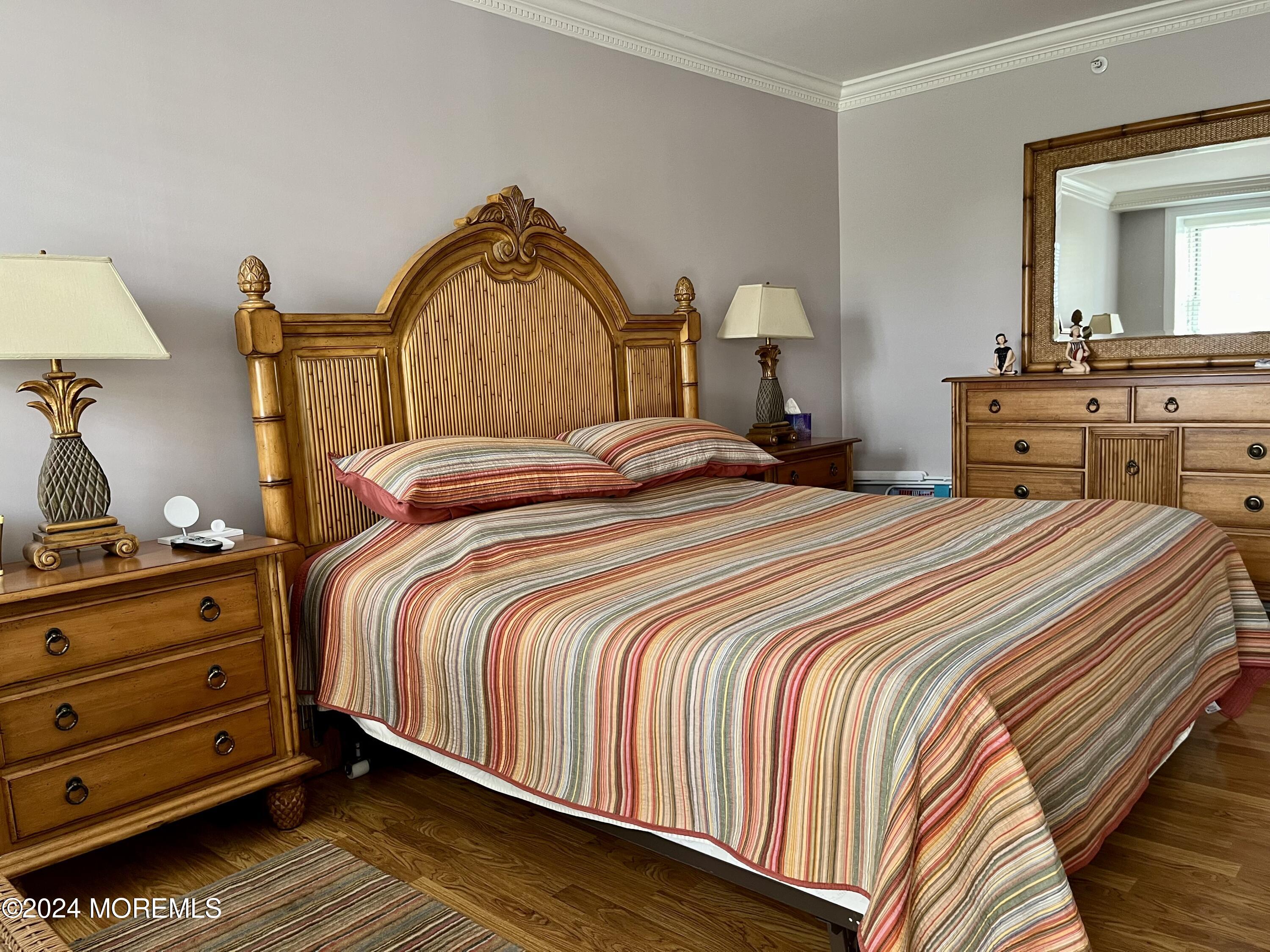 700 Ocean Avenue, Unit G38 Spring Lake, NJ 07762 - Photo 5 of 37 a bedroom with a bed and a dresser