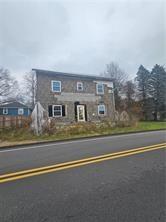 150 Main Street Donegal, PA 15628 - Photo 1 of 1 a view of houses with sky view