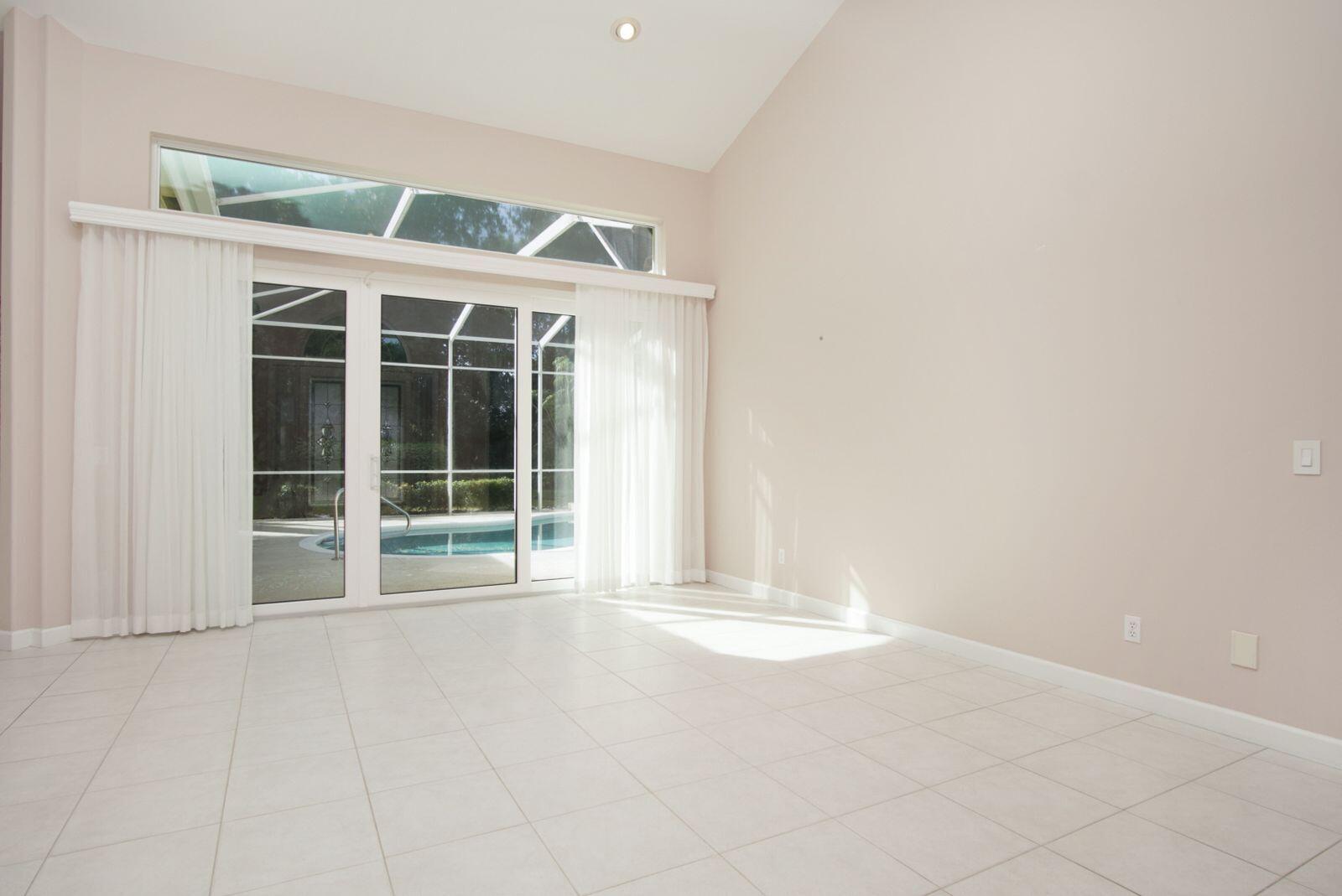 5496 Southeast Reef Way Stuart, FL 34997 - Photo 11 of 35 an empty room with windows