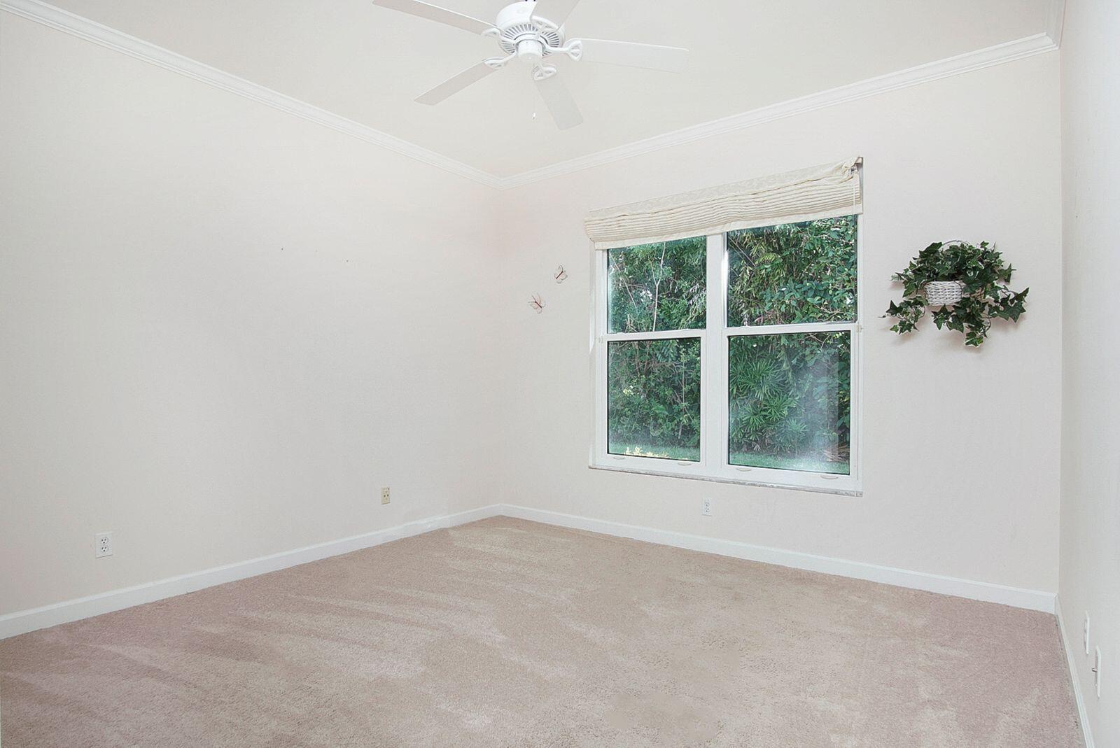 5496 Southeast Reef Way Stuart, FL 34997 - Photo 24 of 35 an empty room with a window