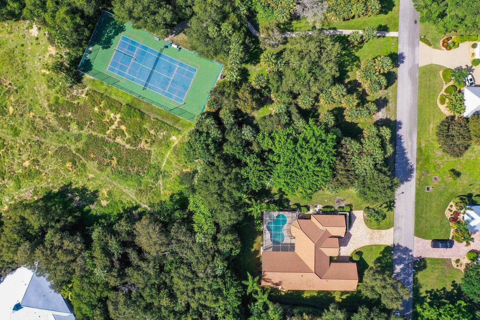 5496 Southeast Reef Way Stuart, FL 34997 - Photo 28 of 35 an aerial view of a house with garden space and street view