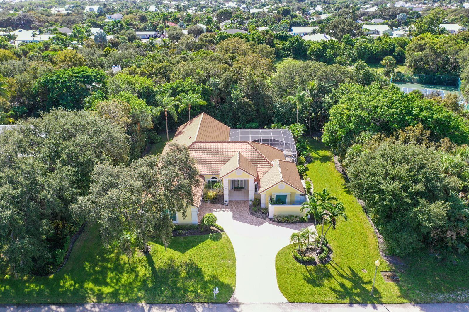 5496 Southeast Reef Way Stuart, FL 34997 - Photo 32 of 35 an aerial view of a house with swimming pool outdoor seating and yard