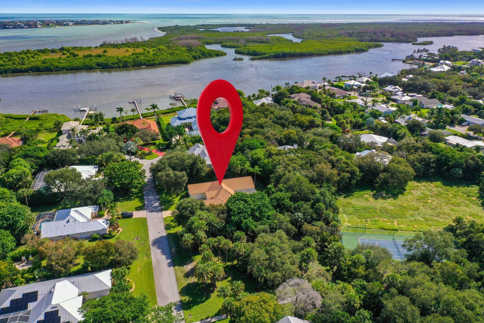 5496 Southeast Reef Way Stuart, FL 34997 - Photo 33 of 35 an aerial view of a golf course with a swimming pool