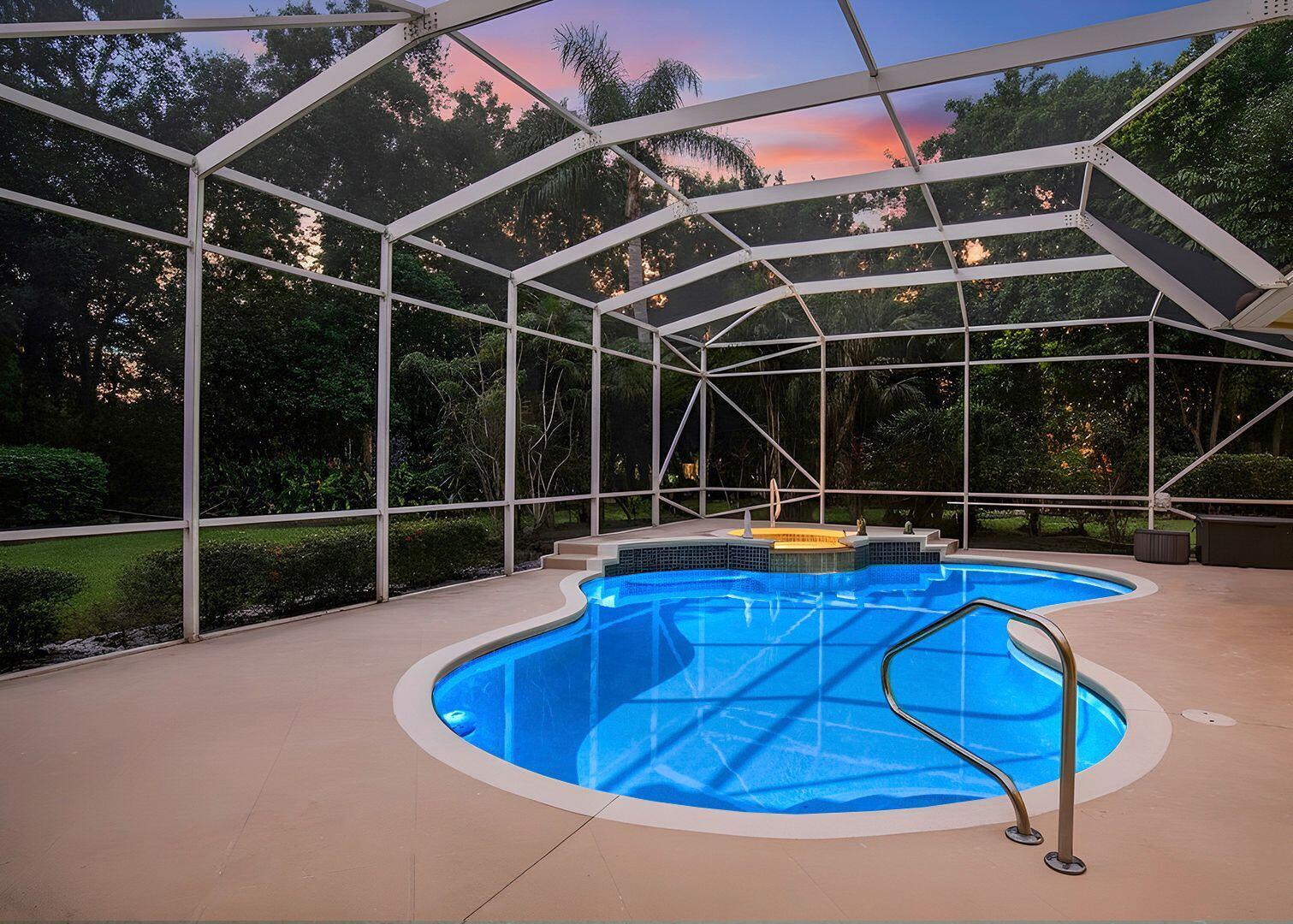 5496 Southeast Reef Way Stuart, FL 34997 - Photo 4 of 35 a view of a swimming pool with a patio