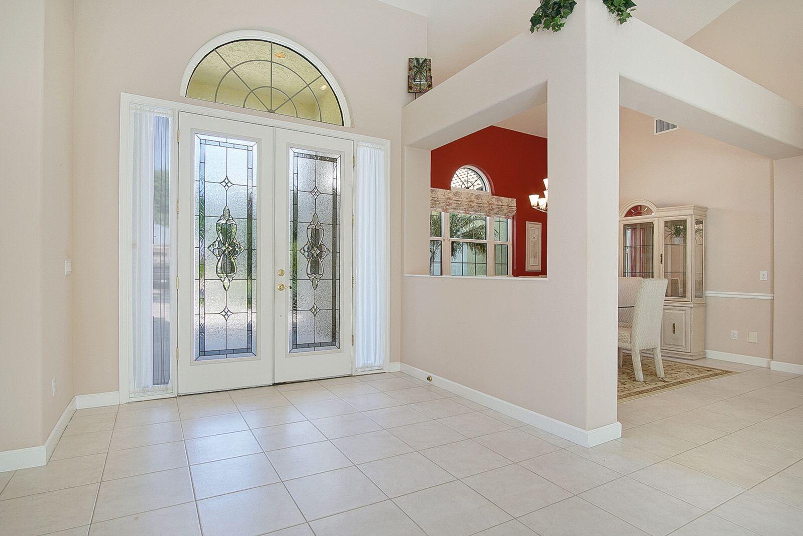 5496 Southeast Reef Way Stuart, FL 34997 - Photo 8 of 35 a view of empty room with front door