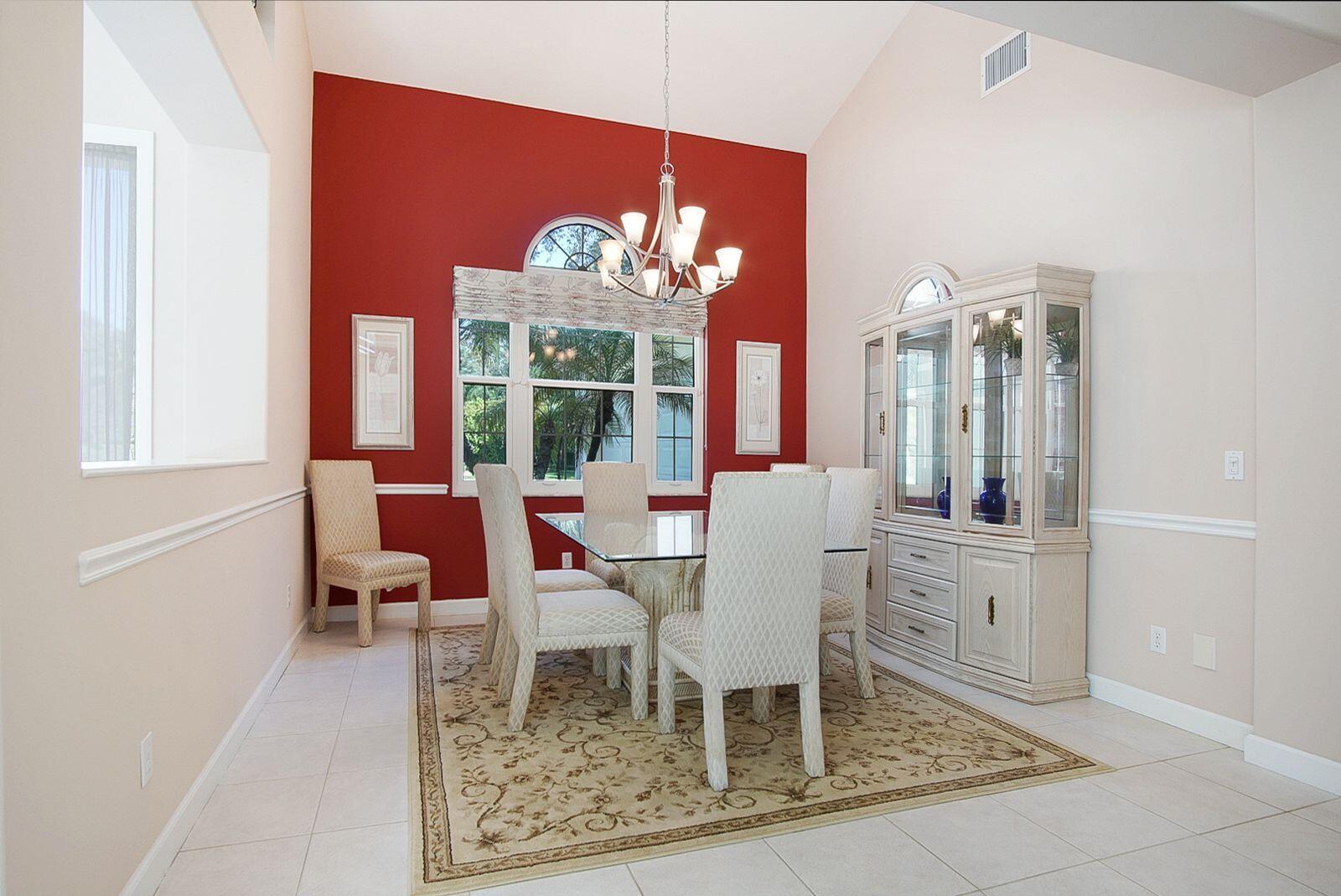 5496 Southeast Reef Way Stuart, FL 34997 - Photo 9 of 35 a view of a dining room with furniture