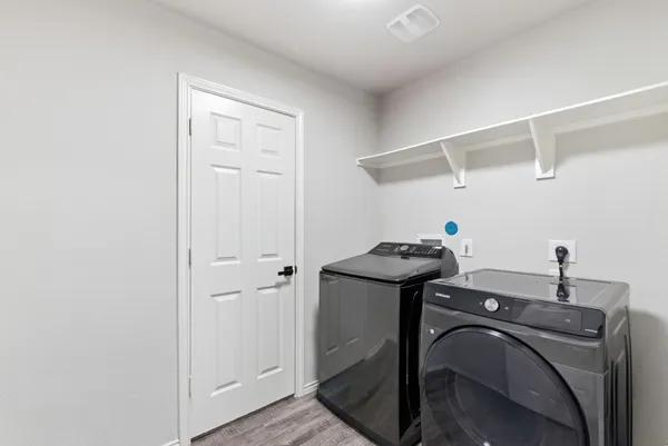 a view of storage and utility room with empty racks