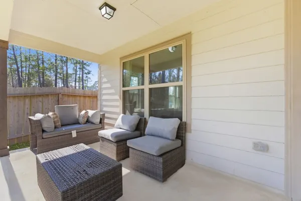 a living room with furniture and a window