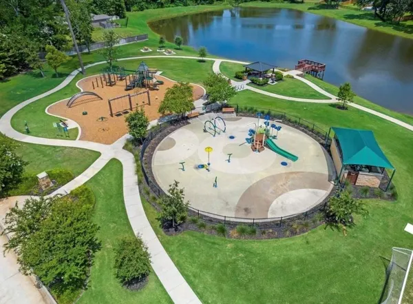 an aerial view of a house with a swimming pool