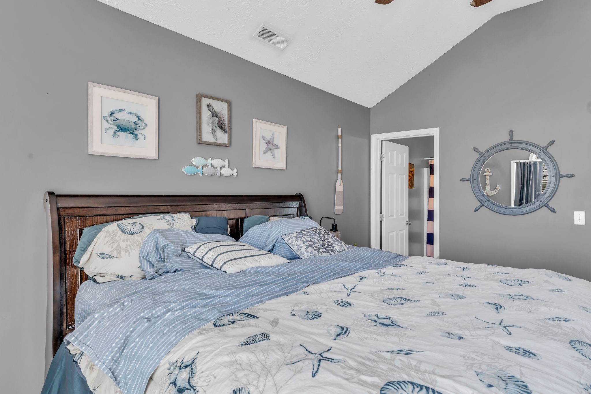 2450 Scotty Parker Road Portland, TN 37148 - Photo 17 of 37 a bedroom with a large bed and a chandelier