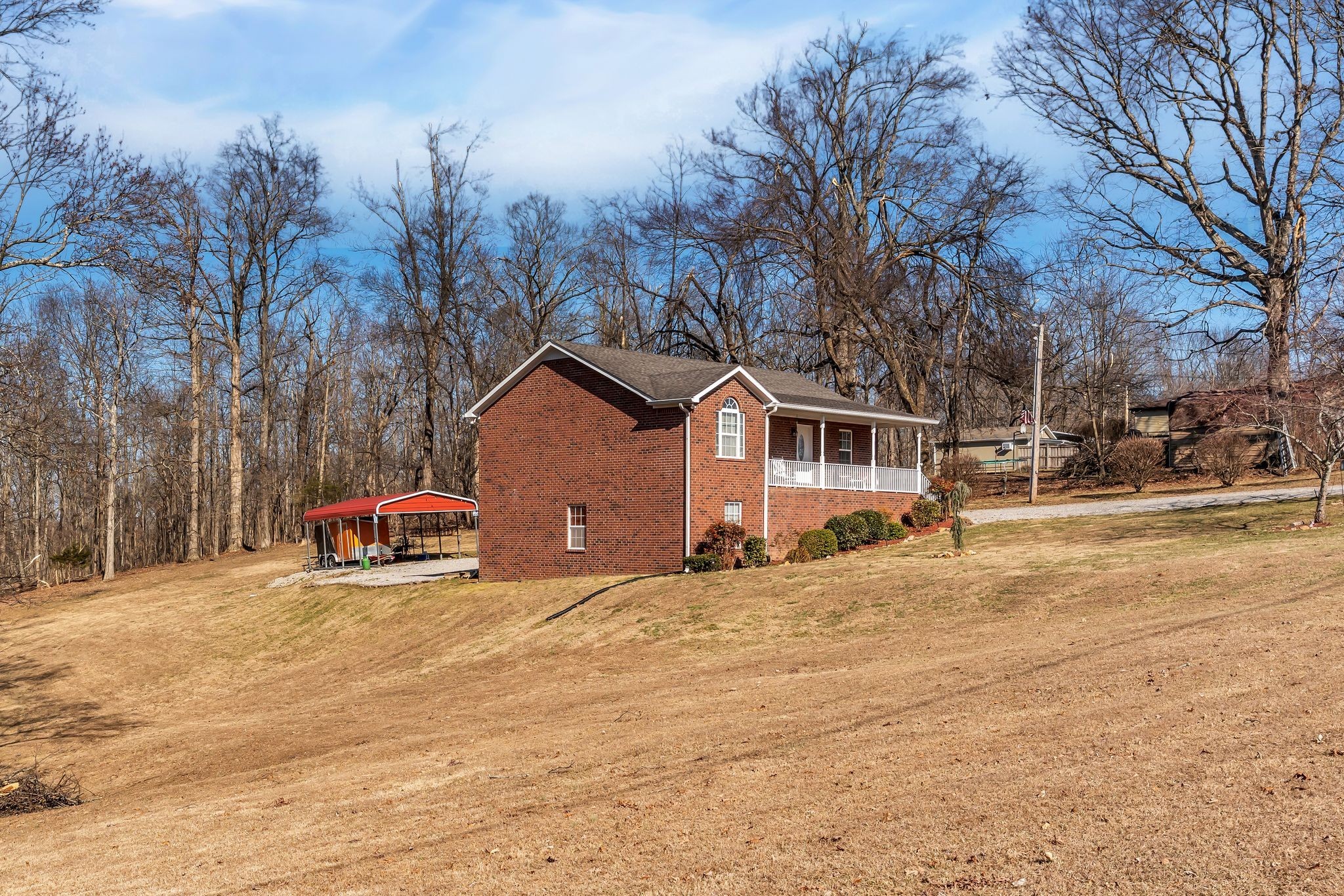2450 Scotty Parker Road Portland, TN 37148 - Photo 2 of 37 a view of a house with snow on the road