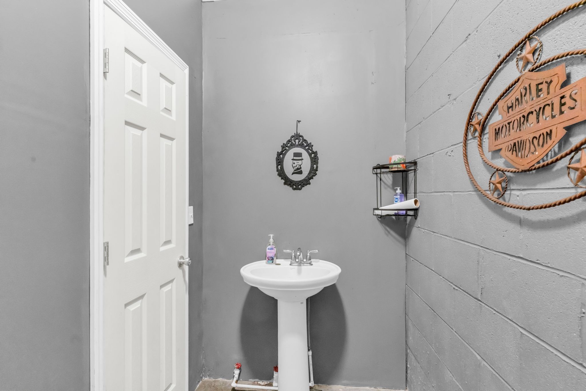 2450 Scotty Parker Road Portland, TN 37148 - Photo 26 of 37 a bathroom with a sink and a mirror