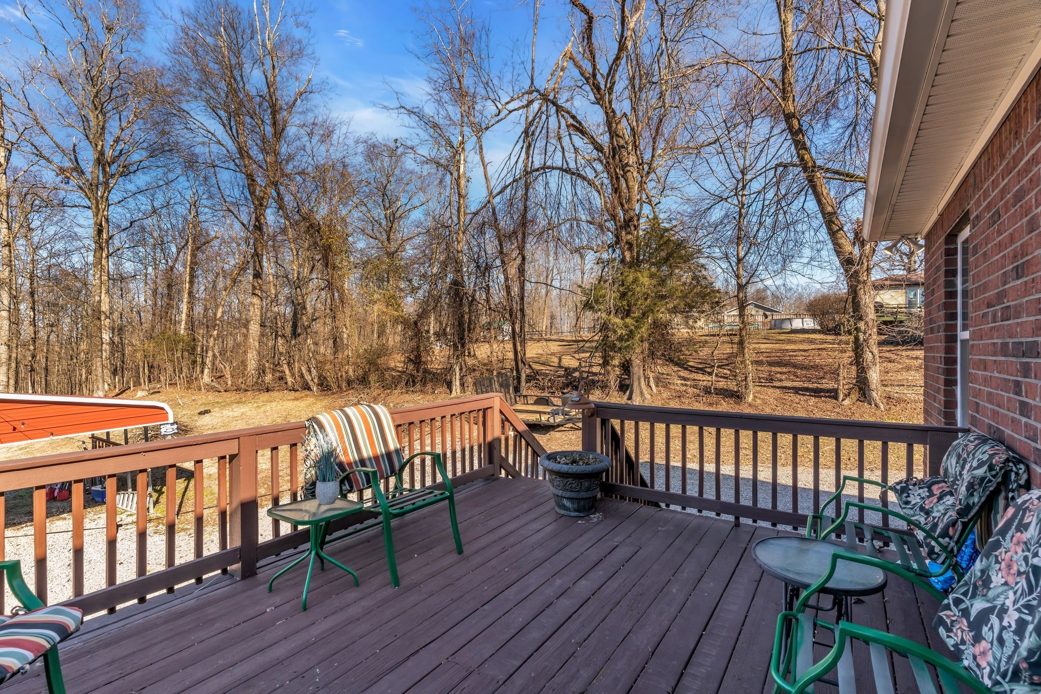 2450 Scotty Parker Road Portland, TN 37148 - Photo 27 of 37 a view of a chairs on wooden deck